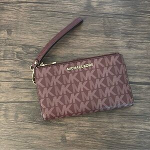 Michael Kors burgundy monogram wristlet clutch